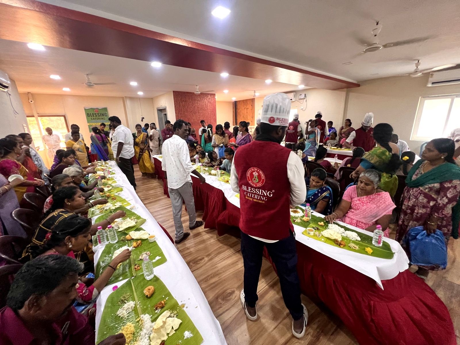 A full dining hall mid-service during a family function