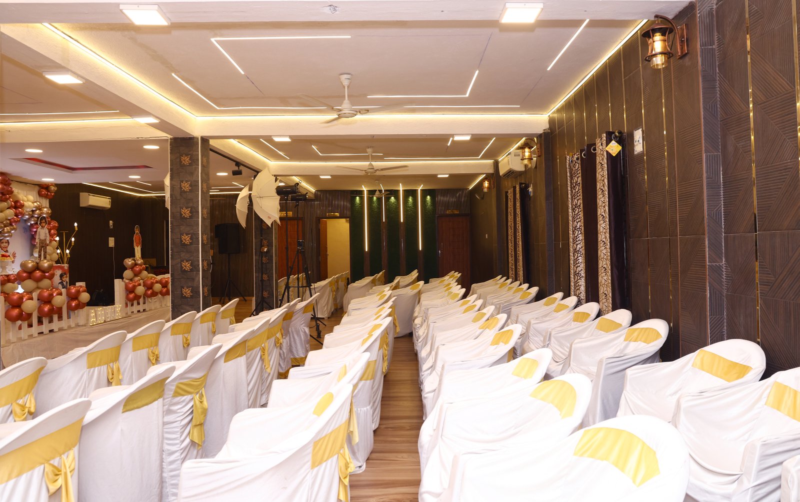 The main hall dressed for a first birthday with a balloon arch
